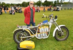 Bob Fay standing with his motorcycle 