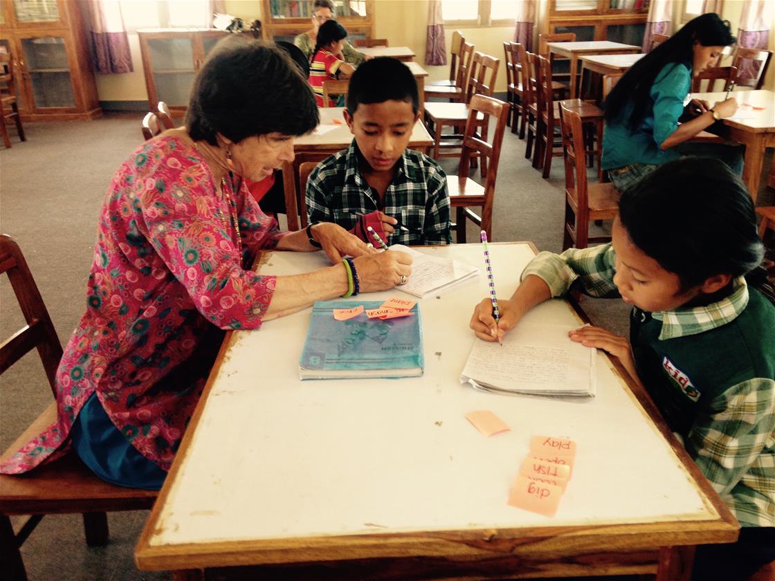 Holcombe helping kids with schoolwork 