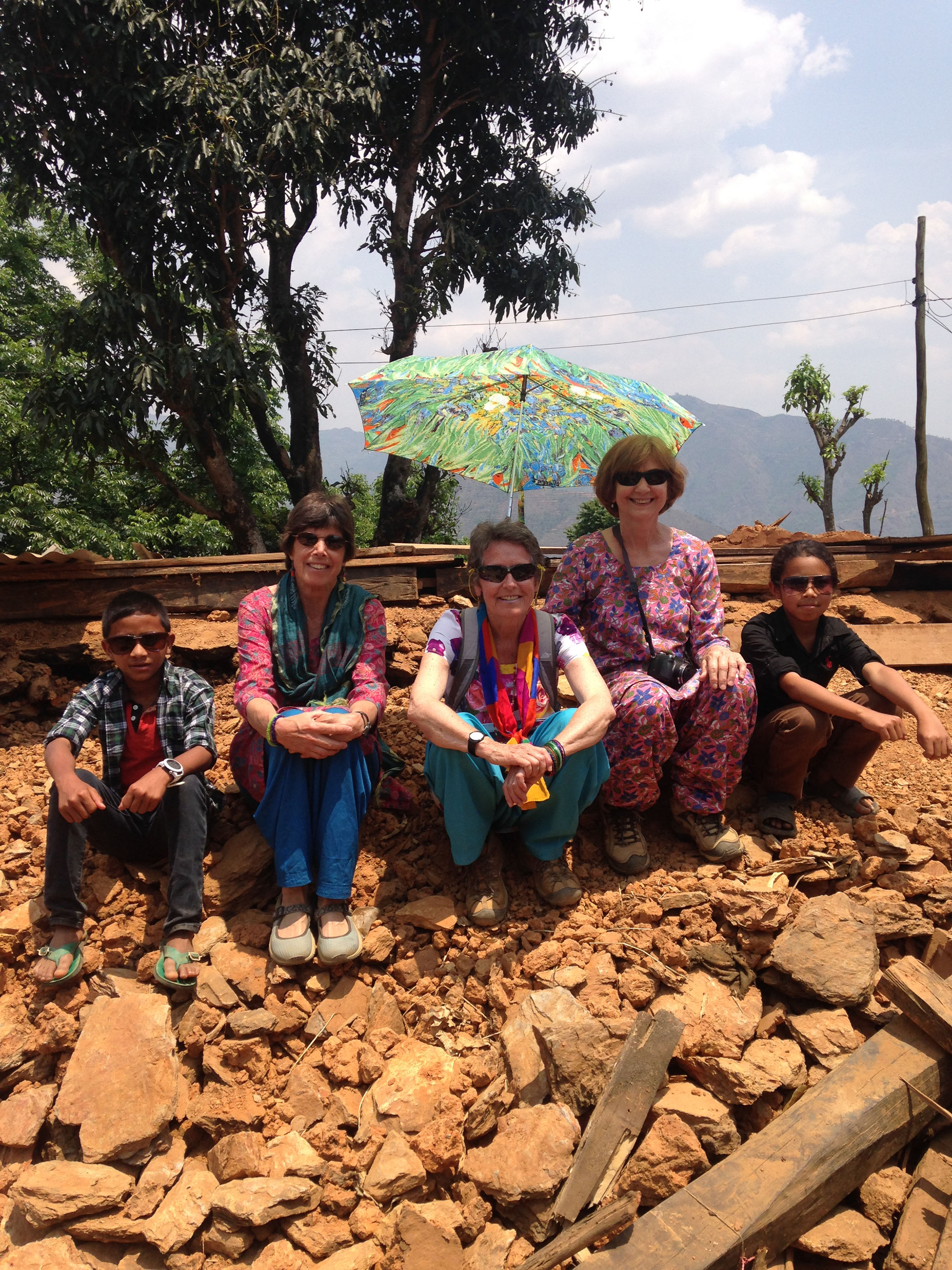 Holcombe with group on earthquake rubble